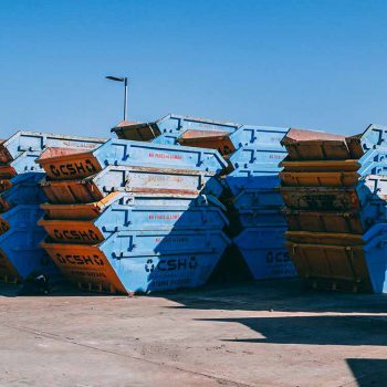 Collection of CSH Environmental skips stood in yard