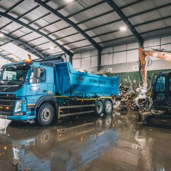 Removing waste from roll on roll off container - CSH Environmental