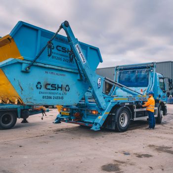 Collecting skip in yard - CSH Environmental