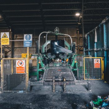 Prominent keep clear sign next to waste compactor - CSH Environmental
